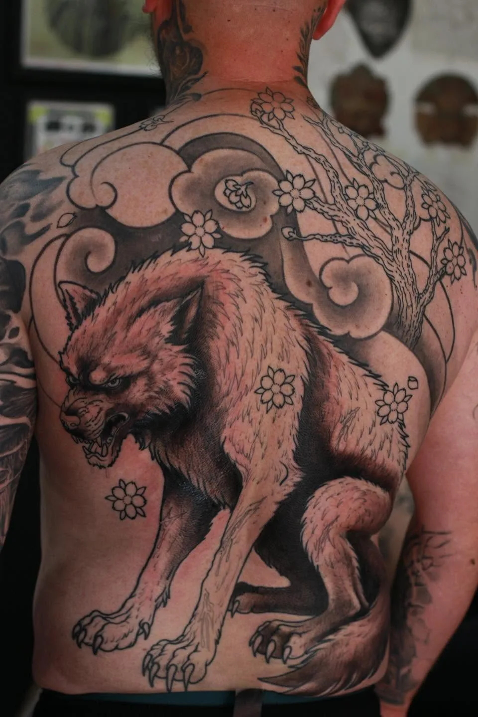 A wolf with flowers across a shoulder